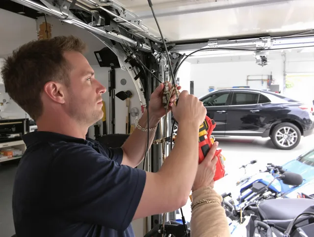Ocala Garage Door Repair safety certified technician performing cable replacement in Ocala