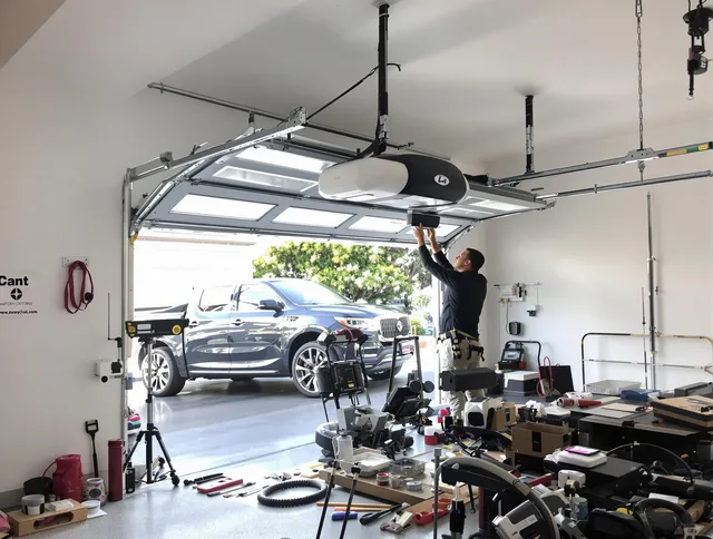 Ocala Garage Door Repair specialist installing smart garage door opener system in Ocala home